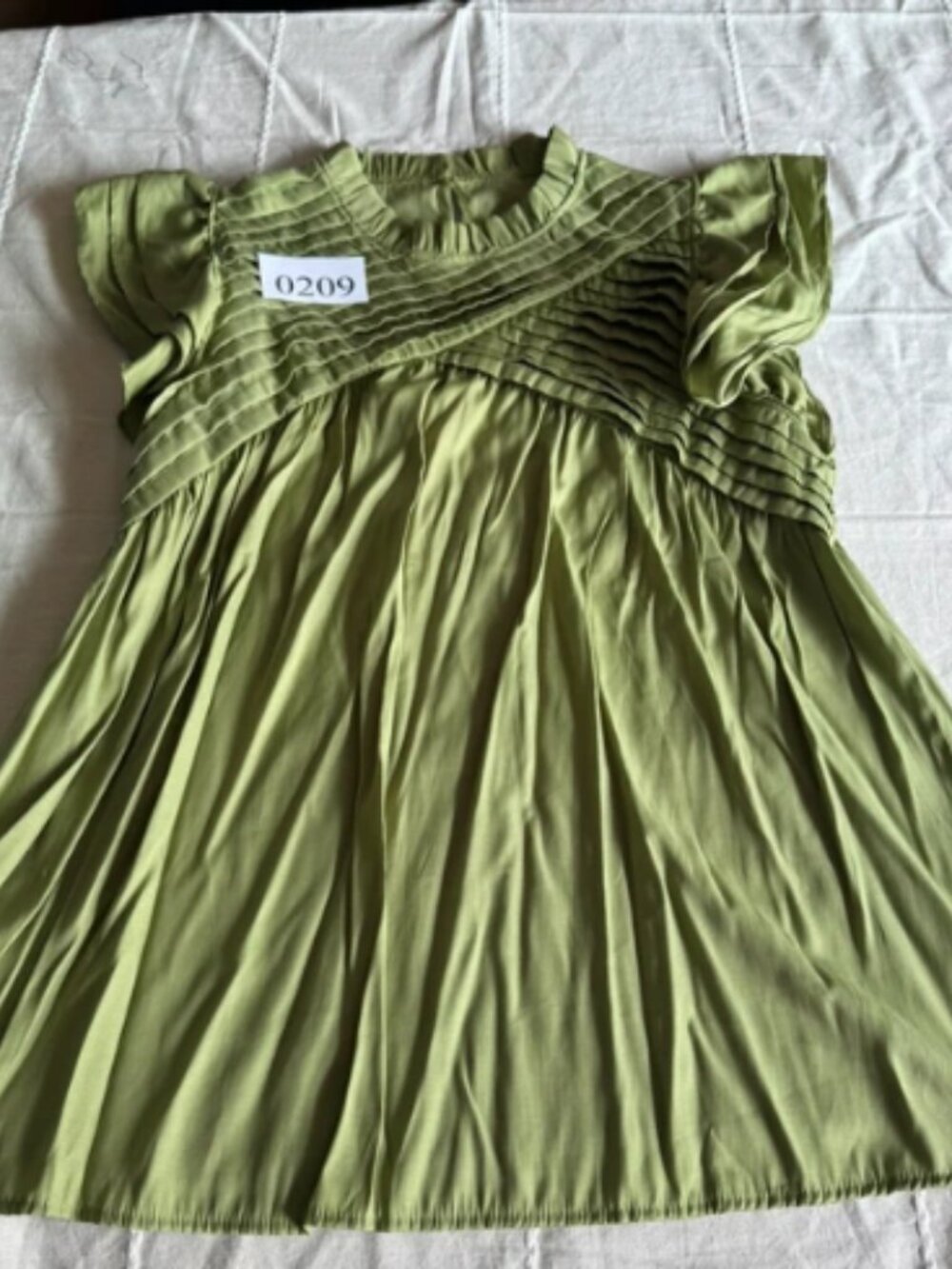 Green babydoll blouse with ruched detailing